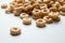 Closeup of a heap of rings breakfast cereal on white background
