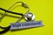 Closeup high colesterol with stethoscope concept inspiration on yellow background