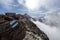 Closeup of a hiking path mark on the background of the mesmerizing snowy Gorner Glacier