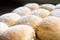 Closeup of homemade austrian powdered buchteln on wooden board