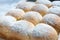 Closeup of homemade austrian powdered buchteln on wooden board