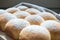 Closeup of homemade austrian powdered buchteln on wooden board