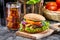 Closeup of homemade hamburger and a Coke with ice