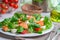 Closeup of homemade salad with salmon and vegetables