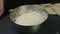 Closeup homemade white yeast dough served in deep metal bowl