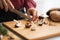 Closeup on housewife cutting mushrooms in kitchen