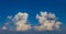 Closeup huge cumulus clouds on blue sky