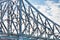 Closeup of a huge metal bridge under the sky