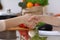 Closeup of human hands cooking in kitchen. Women shaking hands finishing up discussing a menu. Healthy meal, vegetaria