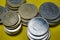 Closeup Hungarian Forint FT HUF coins stacked up in a pile laying on green background