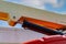 Closeup hydraulic of boom lift. Orange articulated boom lift. Maintenance and repair hydraulic boom lift service. Aerial platform