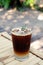 closeup iced americano on bamboo table