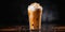 Closeup of Iced Caramel Macchiato at the coffee shop before dark background, with copy space