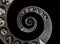 Closeup illustration of a metallic infinity time spiral on black background