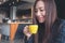 Closeup image of Asian woman smelling and drinking hot coffee with feeling good