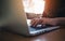 Closeup image of a business woman`s hands working , touching and typing on laptop keyboard