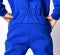 Closeup image on close details of blue jumpsuit overall clothing fabric texture