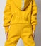Closeup image on close details of yellow jumpsuit with hood overall clothing fabric texture