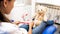 CLoseup image of cute girl with teddy bear waiting for dentist in clinic