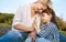 Closeup image of cute little girl playing with her smiling happy mother. Loving beautiful woman and her daughter spending time