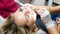 Closeup image of dentist polishing female patients teeth with special drill