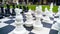 Closeup image of giant chessboard and chess figures in park. Entertainment and fun for family outdoors