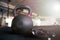 Closeup image of a kettle ball and sports gloves