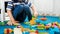 Closeup image of little boy building a house with colorful constructor blocks