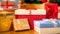 Closeup image of lots of boxes with gifts and presents on floor at house living room