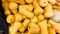 Closeup image of lots of ripe pumpkins lying on counter at grocery store. Closeup texture or pattern of fresh ripe