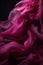 A closeup image of a m of magenta chiffon fabric billowing softly in an ethereal way. Trendy color of 2023 Viva Magenta