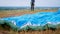 Closeup image of parachute wing lying on grass on field after parachutist landing