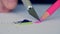 Closeup Image with a Person Hand Sharpening a Colored Pencil