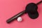 Closeup Image of Stylish Laquered Wooden Brown American Baseball Bat Placed With Clean Leather White Ball and Black Cap Over