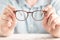 Closeup image: two hands holding classic glasses