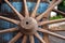 Closeup image of a vintage colored carriage wheels with blue barrelÃ‘Å½