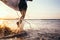 Closeup image water splashes from surfer`s legs run in ocean wit