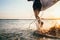 Closeup image water splashes from surfer`s legs run in ocean wit