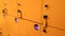 Closeup image of yellow lockers in dressing room or shopping mall