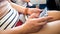 Closeup image of young woman browsing internet on smartphone during flight in airplane