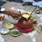 Closeup of Indian groom father offering prayer during marriage.