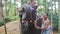 Closeup Indian Men Clean with Brushes Elephant in Park