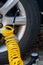 Closeup of inflating car tyre with electric pump.