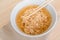 Closeup Instant noodles in white dish and chopsticks on wood background.