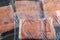 Closeup isolated image of four packs of individually packaged salmon fillets