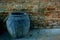 Closeup jar for indigo dyeing fabric at brick wall