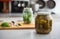 Closeup on jar of pickled cucumbers on table