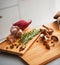 Closeup on jar of pickled mushroom on cutting board