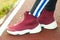 Closeup of jogger feet in red running shoes