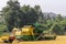 Closeup of John Deere pick Thresher unloading, Hunumanahalli, Karnataka, India